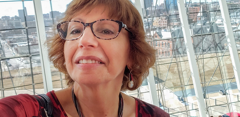 Smiling older woman taking selfie